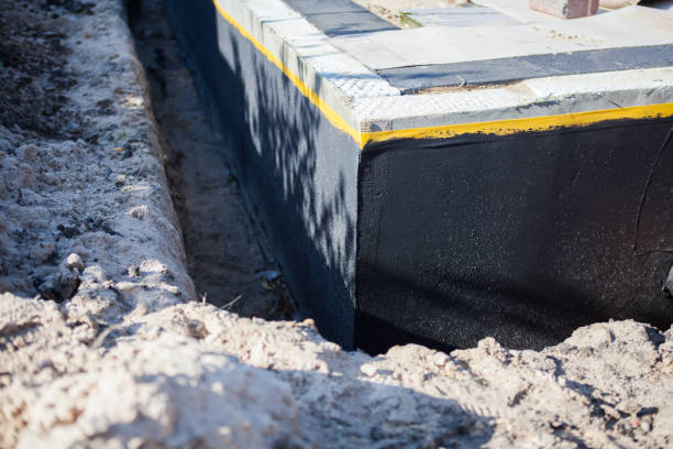 Professional Waterproofing technician working in Berrien Springs, MI